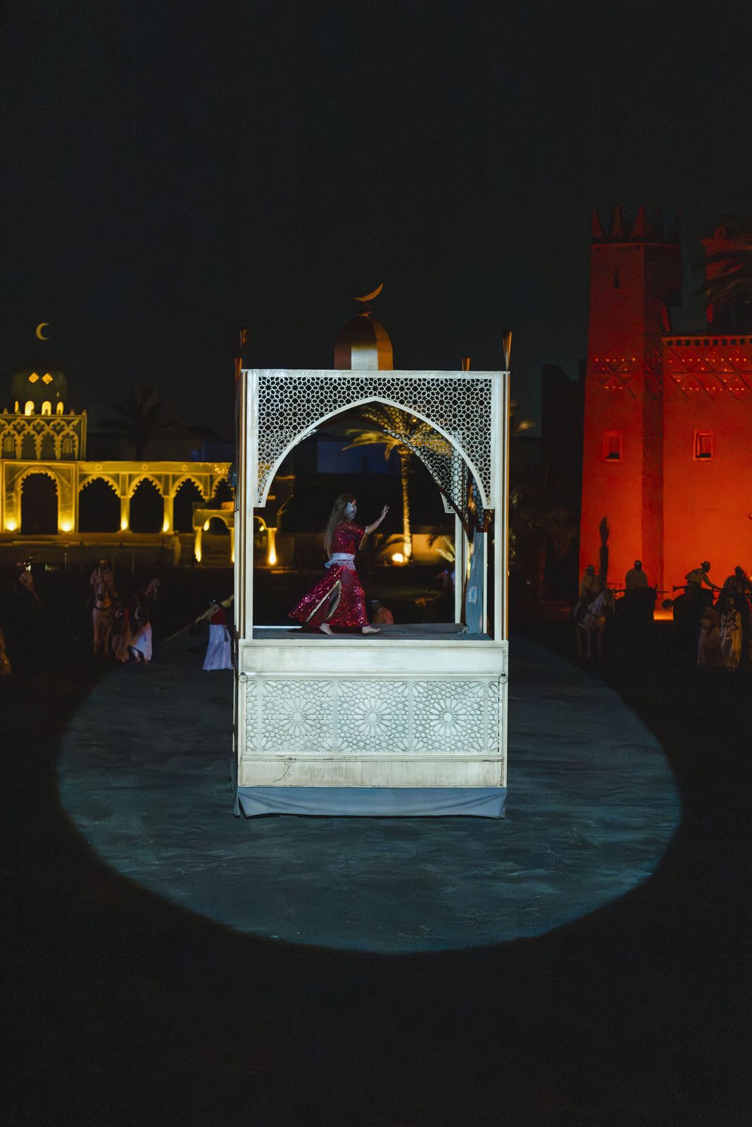 Illuminated pavilion in the arena at night at Chez Ali